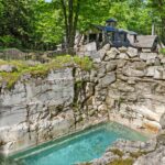 The property features a pool that was originally a limestone quarry.