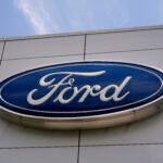 FILE - The Ford logo is seen above the entrance to the Ford Motor Company Kentucky Truck Plant, Wednesday, April 30, 2025, in Louisville, Ky.