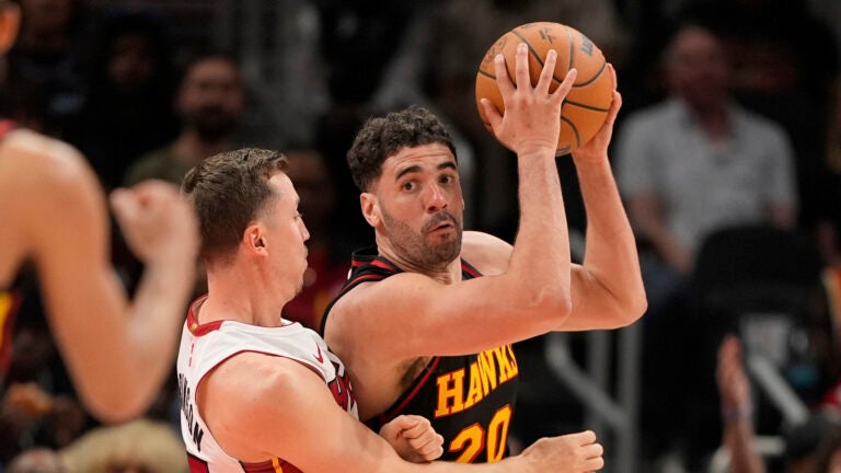 Atlanta Hawks forward Georges Niang (20) looks to pass in the second half of an NBA play-in tournament basketball game against the Miami Heat, Friday, April 18, 2025, in Atlanta.
