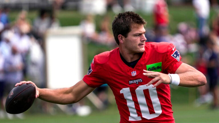 New England Patriots quarterback Drake Maye (10) warms up during today’s joint training camp practice with the Washington Commanders in Foxborough, MA.