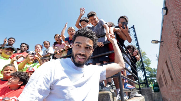 Jayson Tatum excites the kids outside the building to be renovated into the Manton Heights Early Education Center, after a groundbreaking in Providence, RI on Thursday August 7, 2025. The renovation of the Manton Heights public housing complex is being undertaken by the Boston Celtics Shamrock Foundation, Amica, and the Providence Housing Authority.